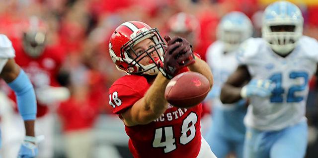 Sophomore tight end Cole Cook lets a pass slip through his fingers against UNC at Carter Finley Stadium on November 28. The pack went 17 for 37 passing with one interception in the contest. The wolfpack lost the game 45-34.