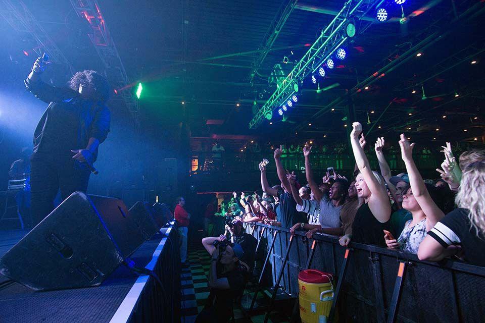 Mir.I.Am, the MC for the UAB After Show, takes a selfie with the crowd. Mir.I.Am is a DJ on K97.5 and an NC State grad.