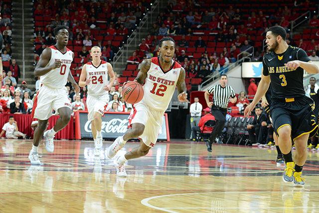 Anthony Barber streaks past a defender. Barber took 14 shots during Sundays game and made eight. The NC State basketball team beat Cal State LA 71-54 at PNC Arena on November 8th.