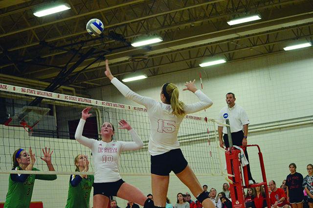 Becky Porter, a setter, sets Kaitlyn Kearney, a middle blocker, up for a kill against Notre Dame on Friday, October 30, 2015. Porter had 6 digs and 2 kills. Kearney had 1 dig and 13 kills. NCSU beat Notre Dame with a final score of 3-2.