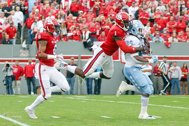 Graduate Safety Hakim Jones makes a diving tackle to stop a UNC touchdown in the first quarter. Jones finished with 4 solo tackles and 6 total tackles. The NC State Wolfpack fell to the UNC Tarheels, in the last home game of the season, 45-34 at Carter-Finley Stadium on November 28, 2015.