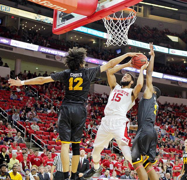 Sophomore forward Cody Martin drives between two Winthrop defenders at PNC Arena Friday. Martin had seven points and two assists in 26 minutes on the court, where the Wolfpack won 87-79.