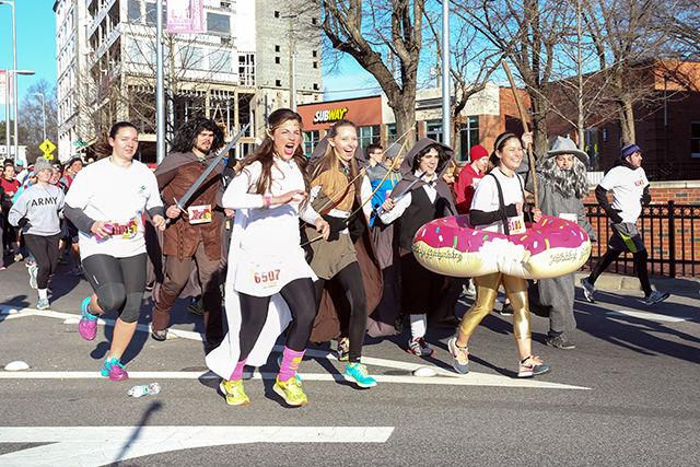 Many students dress up to participate in the annual Krispy Kreme Challenge, a 5-mile race with proceeds benefitting the North Carolina Children&#8217;s Hospital. Here, these participants brought their own &#8220;Lord of the Rings&#8221;-theme music along with costumes to run with.&#160;