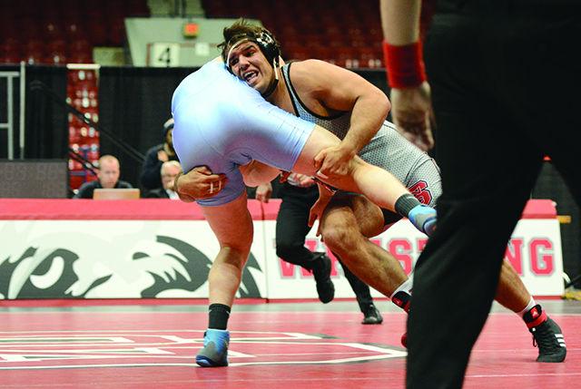 Nick Gwiazdowski, the number 1 ranked college wrestler in the country, takes down his opponent during his match against rival school UNC Chapel Hill. He won his match by a technical fall in Dorton Arena on Monday, January 25, 2015. The number 3 nationally ranked Wolfpack won the duel meet by a score of 28-8, letting them continue their unbeaten streak.