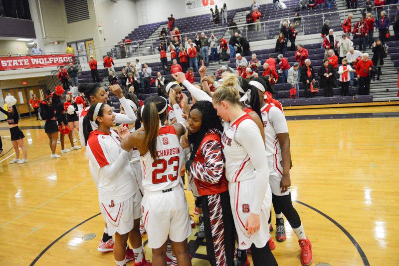 The womens basketball team celebrates their 63-52 win over Virginia. The win in Holliday Gymnasium at Broughton High School on Wednesday, Jan. 27 2016 moves them to 6-2 in the ACC.