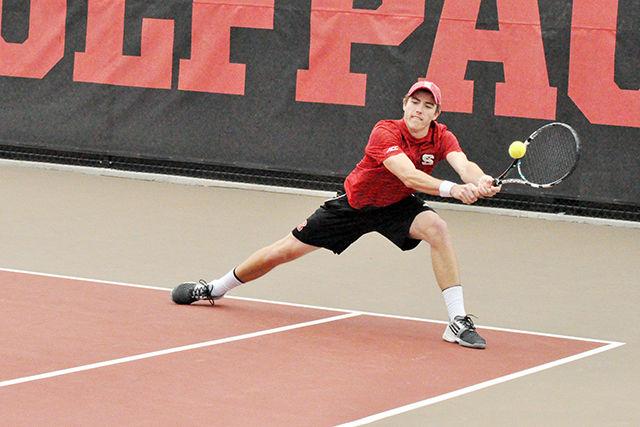 Sophomore Ian Dempster returns a serve from his Virginia Tech opponent in doubles with Senior Robbie Mudge at J. W. Isenhour Tennis Center on March 22, 2015. The pair lost the doubles match from a 7-5 tiebreaker. The Wolfpack lost the meet 4-3 to the 16th-ranked Hokies at J. W. Isenhour Tennis Center on March 22, 2015.