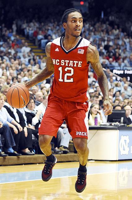 Junior Guard, Anthony 'Cat Barber, dribbles the ball while scanning the court for teamates on Janurary 16th in the Dean Dome. The Wolfpack suffered a 67-55 loss marking there 5th consecutive conference lost.