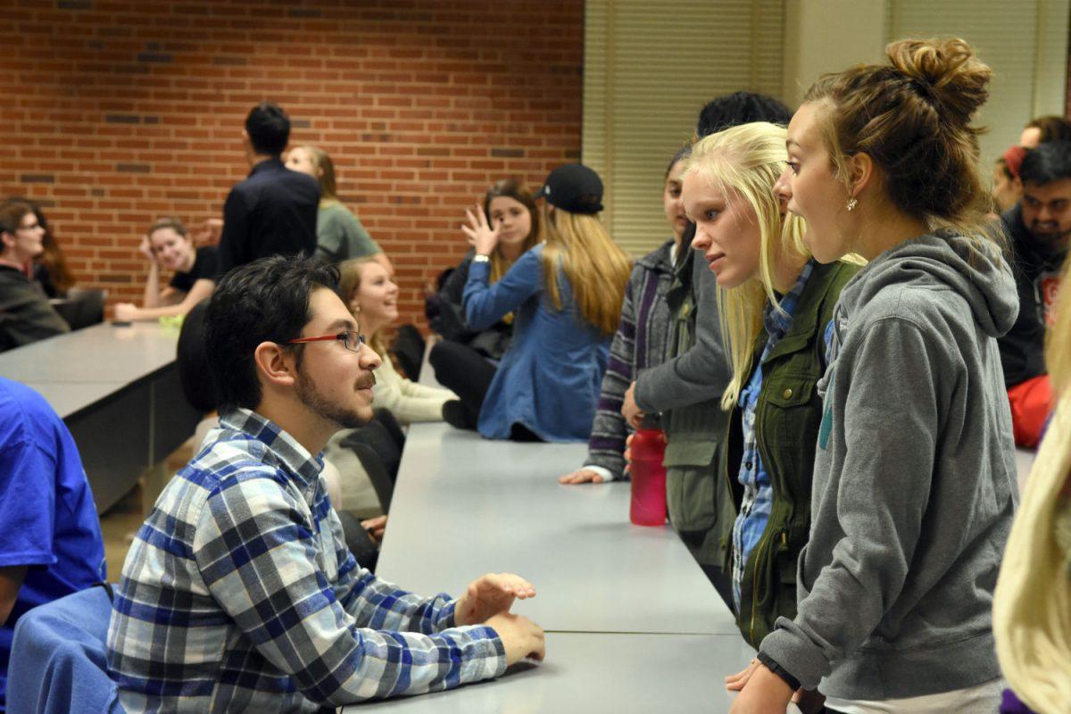 Sebastian Soria Yerena, a junior studying Zoology, talks to Amanda Nobles, a sophomore studying genetics, and Kelsey Downs, a sophomore studying psychology, during a speed dating event hosted by the Beta Delta Chapter of Phi Sigma Pi on January 25th in Mann Hall. Phi Sigma Pi, National Honor Fraternity, used "Speed Dating" as a way for potential members to meet brothers. This "Speed Dating" event is one the five events that will take place this week as Phi Sigma Pi kicks off there spring rush.