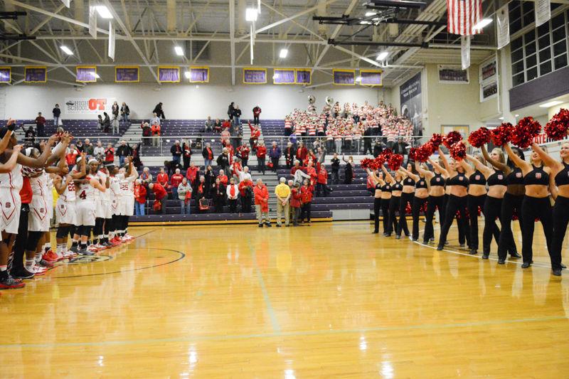 Team lines up to sing the Alma Mater after their win of 63-52 over Virginia in Holliday Gymnasium at Broughton High School on Wednesday, Jan. 27 2016.
