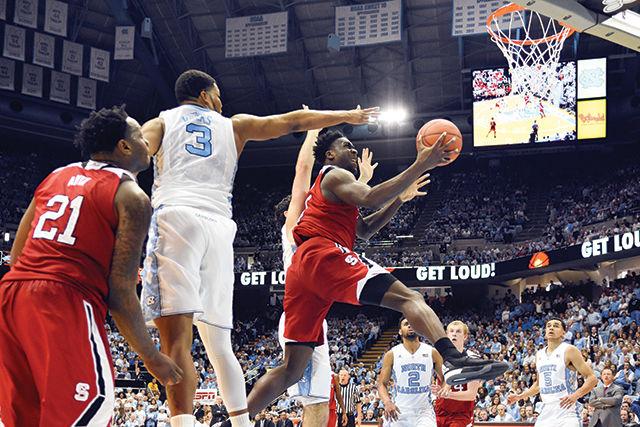Sophomore Forward, Malik-Abdul Abu, goes up for a lay-up on January 16th in the Dean Dome. Abu shot 100 percent from the free throw line and scored his 10th double-double of the season. The Wolfpack suffered a 67-55 loss marking there 5th consecutive conference lost.
