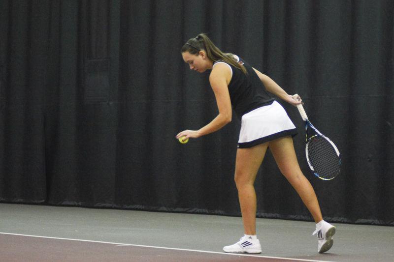 Senior Joanna Nalborska prepares for her serve. Nalborska lost in 3 sets, 6-4, 4-6, 6-4. State had an overall victory of 4-2 against East Carolina University on Mon., Januay 25th, 2016 at J.W. Isenhour Tennis Center.