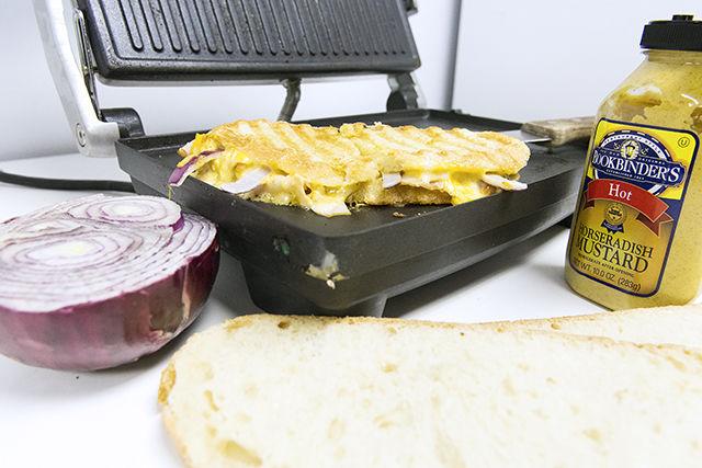 The Turkey Jack Panini sits on a panini maker on Janurary 19th in the Student Media break room. The Turkey Jack Panini is a combination of jack cheese, sliced roast turkey, horseradish mustard and fresh cut red onion.