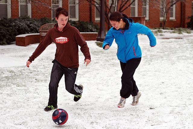 Residents of NC State's Honors Village, or Honors Quad, get physical in a game of "snoccer," a clever combination of the words "snow" and "soccer," Saturday afternoon.&#160; Residents said that sometimes it's hard to find something fun to do during inclement weather &#8212; especially inclement weather involving sub-freezing temperatures &#8212; so they decided to make their own fun. Though "snoccer" is not a regularly schedule Quad activity, the sport may reappear in the future if snowy or icy conditions persist.