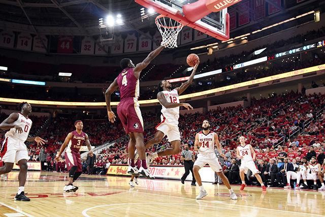 Junior guard Anthony 'Cat' Barber goes underneath a defender for a layup in the Wolfpack's 85-78 loss to Florida State on January 13, 2016. Barber made 6 of 14 field goals, 2 of 5 three three-pointers and had a total of 16 points in the loss at PNC Arena.