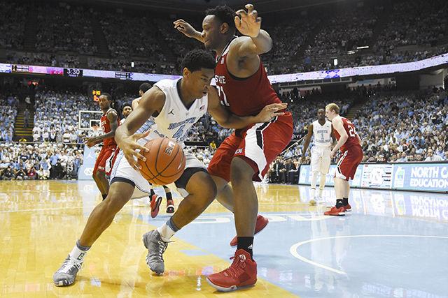 Junior Forward, Isiah Hicks, posts up Junior Forward, Beejay Anya, on Janurary 16th in the Dean Dome. The Wolfpack suffered a 67-55 loss marking there 5th consecutive conference lost.