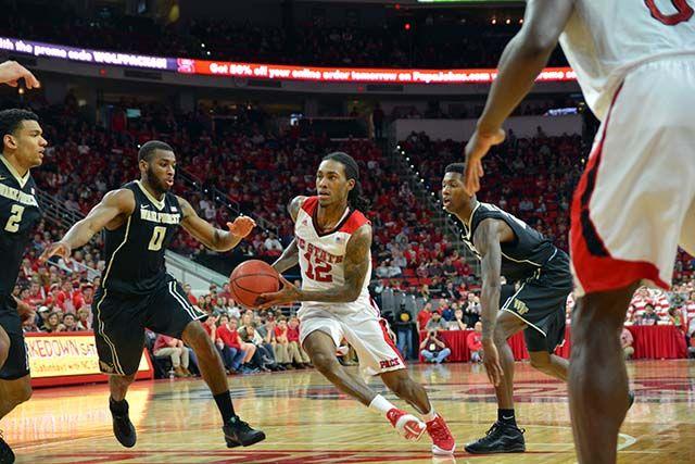 Junior guard Anthony "Cat" Barber weaves inbetween Wake Forest players preparing to shoot the basketball during the game against Wake Forest Saturday, Feb. 13, 2016. Barber scored a career high of 38 points during the game, helping the Wolfpack win 99-88.