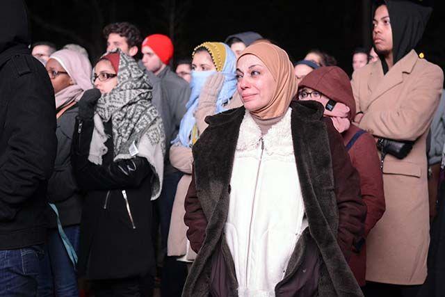 Nahla Bwehji came to the candlelight vigil in Stanford Commons for Our Three Winners on Feb. 10th, 2016. Bwehji remembers Deah Barakat, Yusor Abu-Salha and Razan Abu-Salha as she listens to the speehes given.