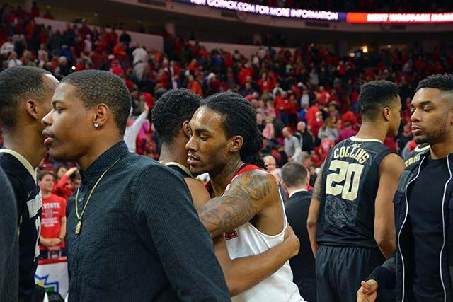 Junior guard Anthony "Cat" Barber hugs freshman guard Bryant Crawford from Wake Forest after winning the basketball game on Saturday, Feb 13, 2016. Barber scored a career-record of 38 points, helping the Wolfpack win 99-88.
