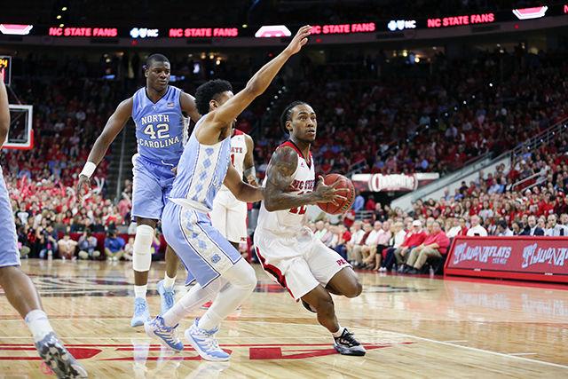 Junior guard Anthony 'Cat' Barber drives to the hoop and scores a layup in the first half. Barber finished the first half shooting 7-15 from the field, with 3 rebounds and 1 steal. The NC State Wolfpack trail UNC 38 to 33 at halftime at PNC Arena on February 24, 2016.
