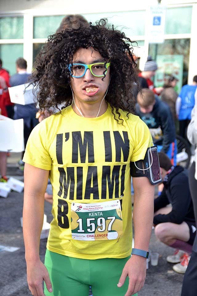 Kenta Shirafuji from New York eats his doughnuts dressed up as a member of the musical group LMFAO during the Krispy Kreme Challenge on Saturday, Feb. 6th, 2016.