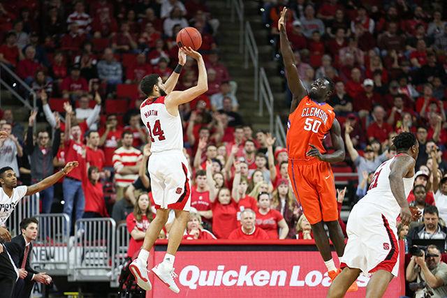 Caleb Martin makes a three from the corner during the Clemson vs NC State basketball game at PNC Arena on February 20, 2016.