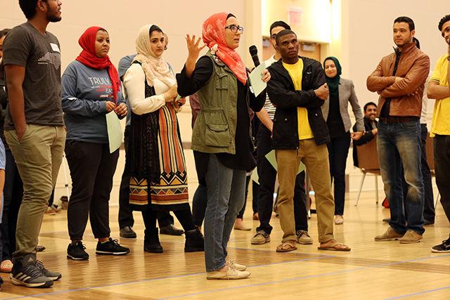 Miriam Zouhri, a junior studying at Meredith College, shares her perspective with the group during an activity where participants would stand in separate areas of the room indicating whether they agree, disagree, or are in between with presented with a statements on February 28, 2016. The activity was a part of the Interfaith: Dismantling Stereotypes event held in Talley Student Union. Zouhri said she was happy to see that the event stressed taking action after interfaith events like this. She said "everybody here is already ok with talking about their faith. But what's important is taking what we learned here and implementing it in our lives."