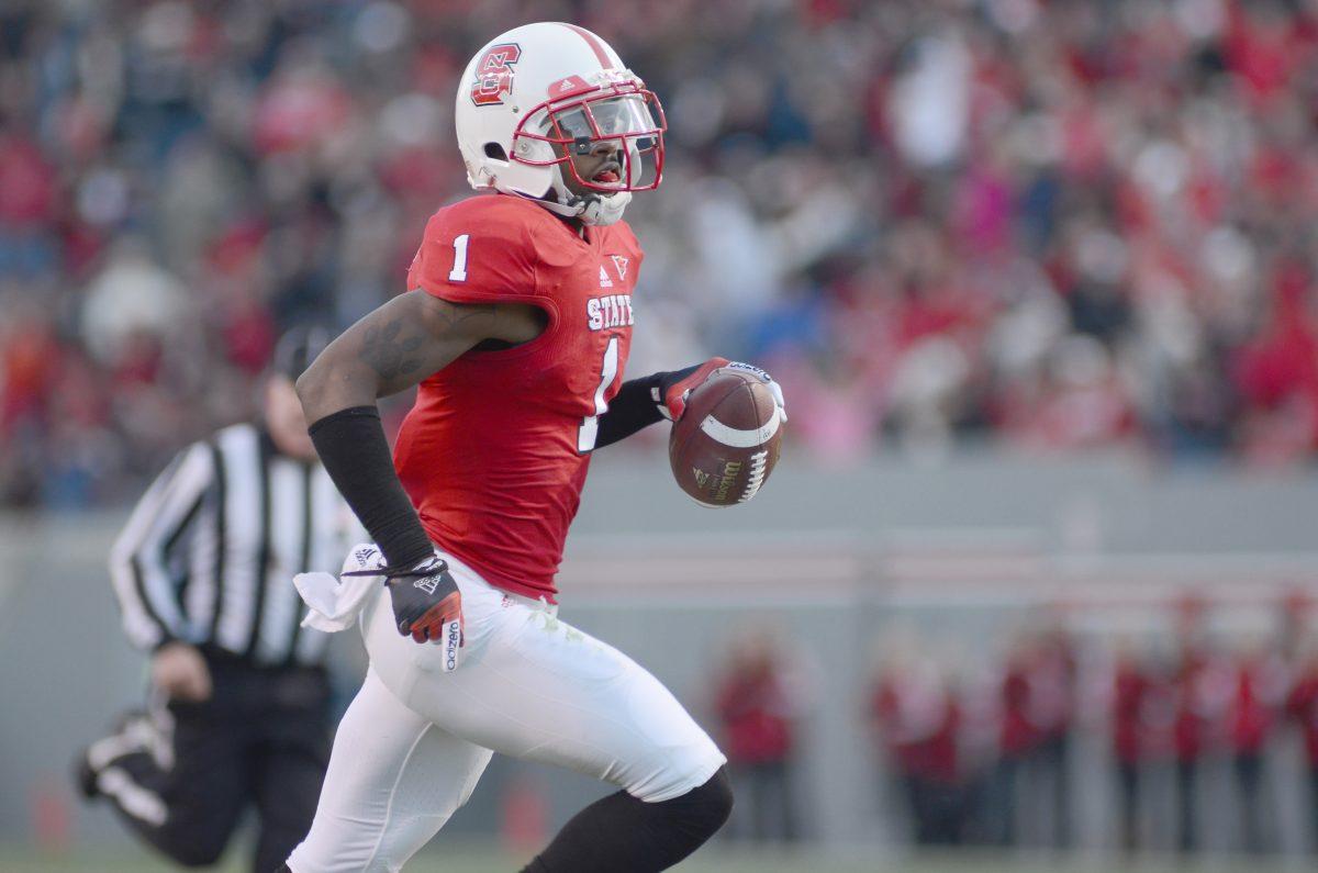 Junior cornerback David Amerson runs back after making an interception against Boston College Saturday, November 24, 2012. Amerson returned the interception for a 55-yard touchdown in the Wolfpack's 27-10 win over the Eagles at Carter-Finley Stadium.