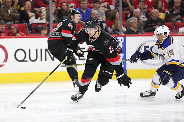 Hurricanes Defenseman Noah Hanifin dribbles the puck up the ice in the second period. Hanifin recorded one hit and one takeaway in 15:31 minutes on the ice. The Hurricanes were without their Captain Eric Staal, who was traded to the New York Rangers minutes prior to the start of the game. Kris Versteeg didn&#8217;t finish the game due to being traded to the Los Angeles Kings during the second period. The shorthanded Carolina Hurricanes lost to the St. Louis Blues 5-2 at PNC Arena on February 28, 2016.