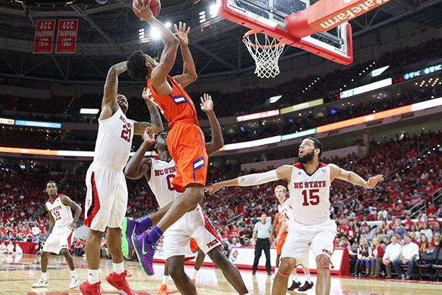 A Clemson player attempts a floater during the Clemson vs NC State basketball game at PNC Arena on February 20, 2016.