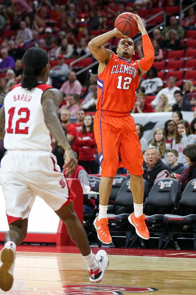 A Clemson player takes a three during the Clemson vs NC State basketball game at PNC Arena on February 20, 2016.