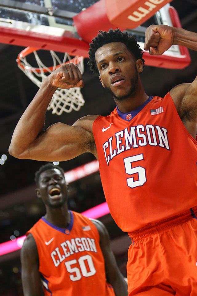 A Clemson guard flexes after drawing a foul and scoring a layup at the end of the game during the Clemson vs NC State basketball game at PNC Arena on February 20, 2016.