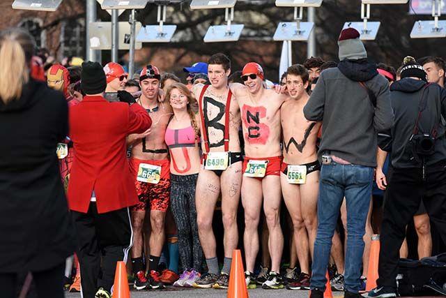 Participants stand at the starting line waiting to begin the challenge. The Krispy Kreme Challenge had around 7000 registered runners and raised $195,000.