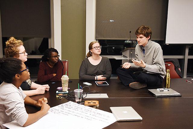 Mitchell Moravec, a senior studying psychology and a cohort member at the Women&#8217;s Center, sits on the table discussing solutions to one of the action items determined by the racial climate town hall. "I think it's realistic to make social justice and diversity a requirement for student organizations," Moravec said.