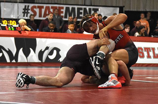 Max Rohskopf, junior 165 pounder, attempts to finish a single leg during his match against in conference opponent Virginia Tech. The number 8 ranked Hokies would go on to beat the Wolfpack by a score of 19 to 14 in the Holshouser Building on Friday, Feb 12, 2016.
