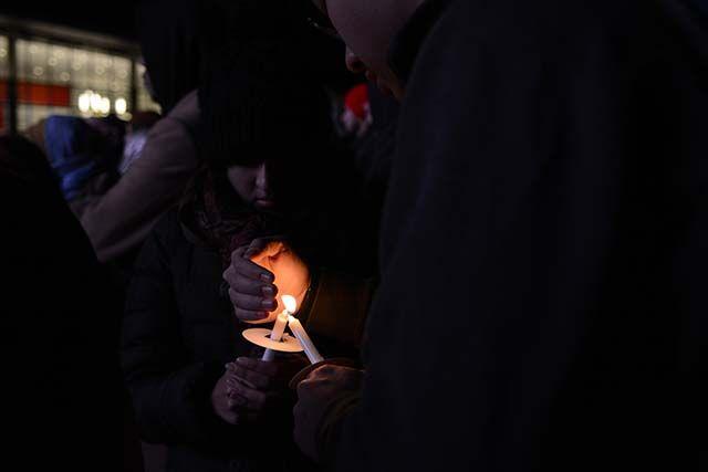 Attendees of the Our Three Winners Memorial light candles in tribute to Deah, Yusor, and Razan. The Memorial took place outside of Talley Student Union on Wednesday, Feb. 10 2016 in honor of the one year anniversary of their passing.