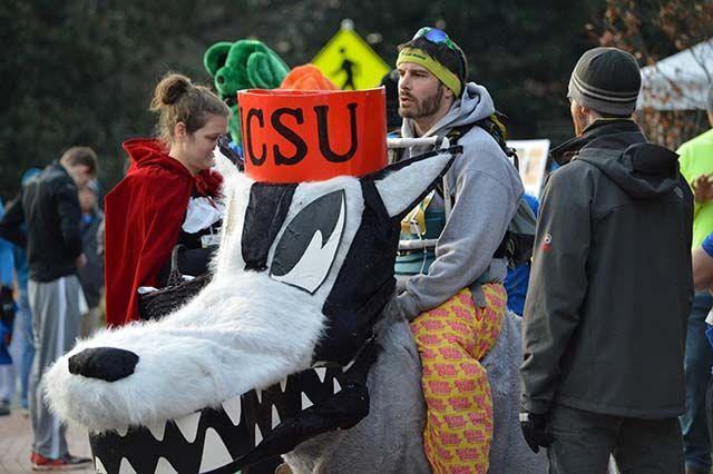 Tom Place, an '07 NC State Alumni dressed as Mr. Wuf, waits for the beginning of the Krispy Kreme Challenge. The challenge had over 7000 registered runners and raised over $195,000 for the North Carolina Children's Hospital on February 6th, 2016.