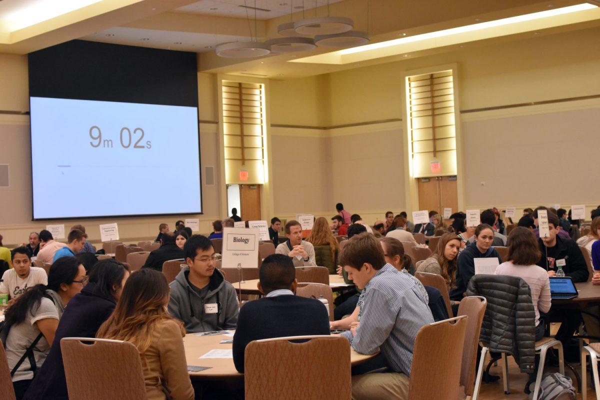 Students share a quick chat with professors from different departments as the clock counts down.