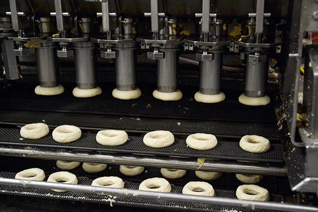 The Krispy Kreme doughnut machine automatically cuts the dough to be cooked into the circle shape it exhibits. The machine will cut 400 doughnuts in an hour, equaling 9,600 doughnuts a day.
