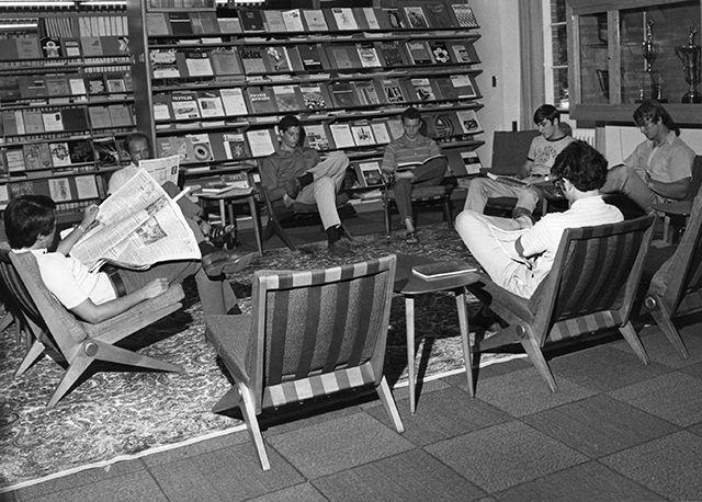 Circa 1970-1979. Students read in the textile library collection of D.H. Hill.