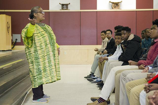 Tony "Mama" Thorpe, Program Coordinator for the African American Cultural Center, greets members of the Black Male Intiative Group at the Beginning of the 2016 Blacks in Wax Tour on Feburary 20th. The Blacks in Wax program is a live wax musuem featuring students honoring individuals who have made siginificant contribution to Black History.