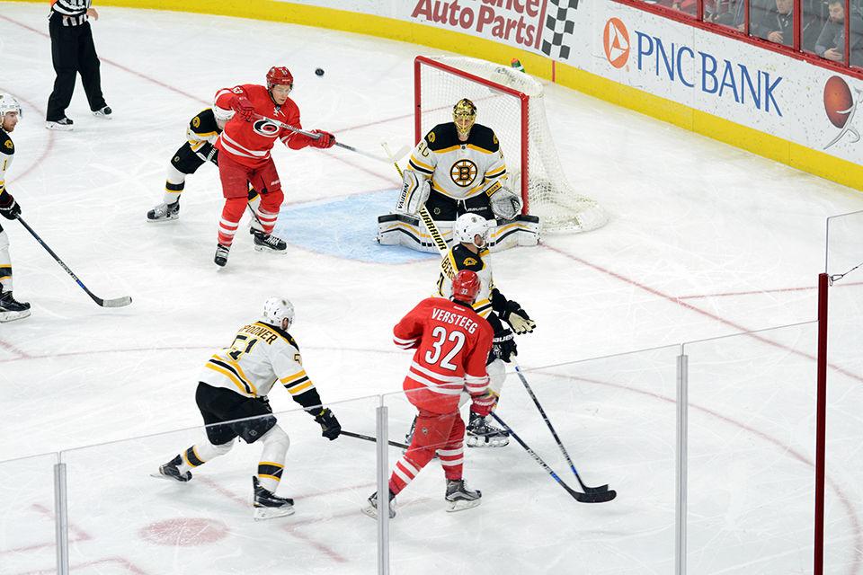 Carolina Hurricanes right forward Kris Versteeg attempts to pass the puck to left forward Jeff Skinner during the second period of the game on Friday, Feb 26, 2016.