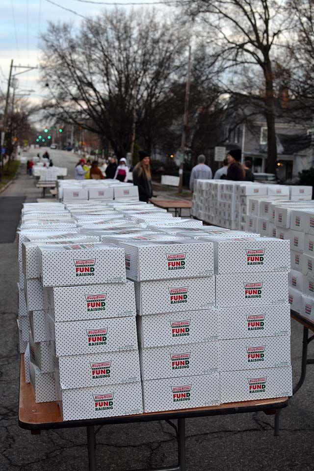 Boxes of Krispy Kreme doughnuts are set up along N. Person Street for the runners of the 12th Annual Krispy Kreme Challenge on Feb. 6, 2016. The run had approximently 7000 registered particpants.