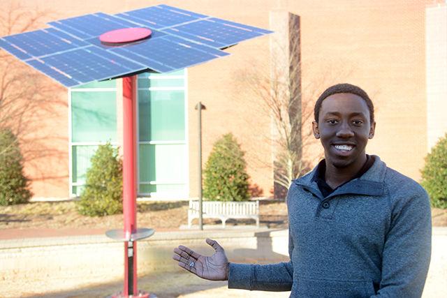 Xavier Primus, co-chair of the Solar Energy Tree Project, stands beside the charging station located near the Hunt Library on Centennial Campus.&#160; &#8220;We&#8217;re always trying to improve our use of technology and the environment, and this was the perfect centerpiece,&#8221; Primus said.