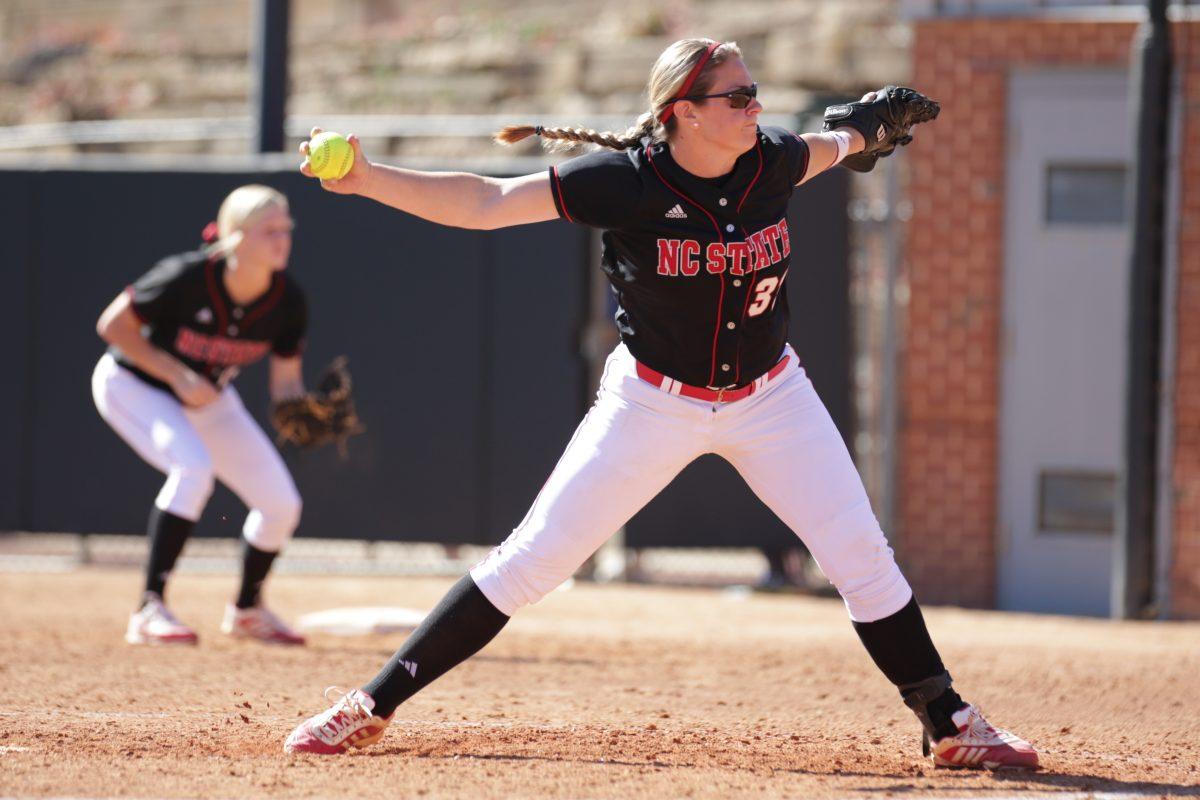 Senior pitcher Emily Weiman sends a fastball toward the waiting batter. The Wolfpack beat Pitt Community College 3-1 in the first game of a doubleheader Oct. 25, 2014.