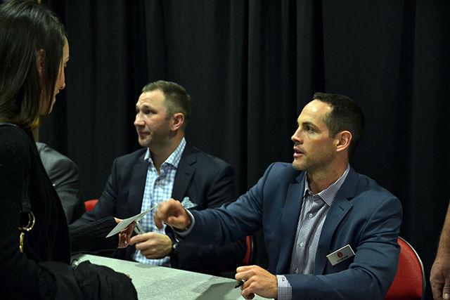 Former Carolines Hurricanes Stanley Cup winners Erik Cole and Craig Adams sign autographs for fans along with former Carolina Hurricanes Stanley Cup winner Niclas Wallin (not pictured) at the Hurricanes game against the Pittsburgh Penguins Friday, Feb 12, 2016.
