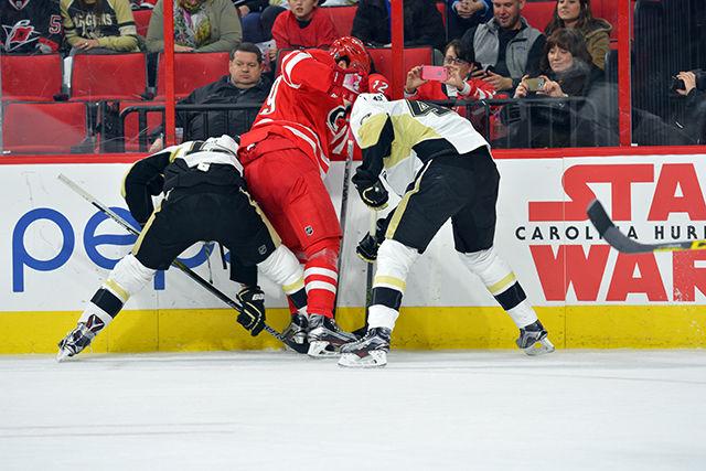 Center forward Victor Rask attempts to gain control of the puck from the Pittsburgh Penguins during the third period of the game Friday, Feb 12, 2016. The Carolina Hurricanes lost to the Penguins 2-1.