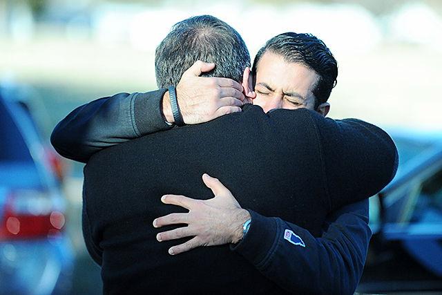 Namee Barakat hugs a family member before holding a press conference on the killings of Deah Shaddy Barakat, Yusor Abu-Salha and Razan Abu-Salha Wednesday, Feb. 11, 2015. The press conference was held at the Swift Creek Community Center in Cary, NC.