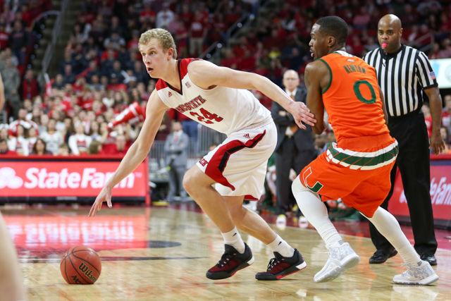 Freshman guard Maverick Rowan crosses up a defender and pulls up for a jumper in the second half of the game. Rowan finished the game with nine points on 1-6 shooting and 6-8 free throws. Rowan also had seven rebounds, two assists, and one steal. NC State beat Miami 85-69 at PNC Arena on January 30th, 2016.