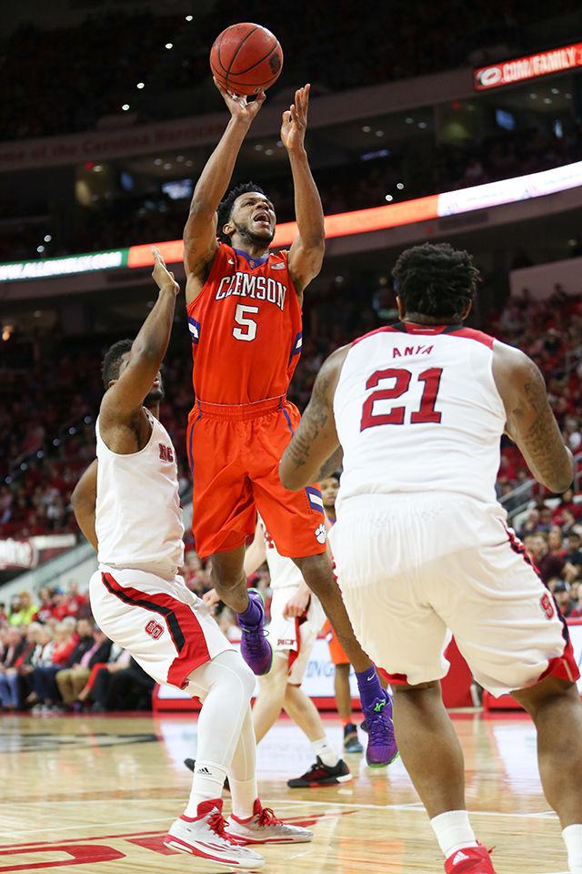 A Clemson player takes a jumpshot during the Clemson vs NC State basketball game at PNC Arena on February 20, 2016.