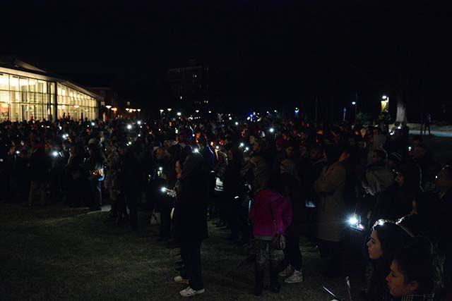 Students used their phones after attempting to light candles during the memorial for Our Three Winners. The memorial was held hte night of Wednesday, Feb 10, 2016 on Stafford Commons.